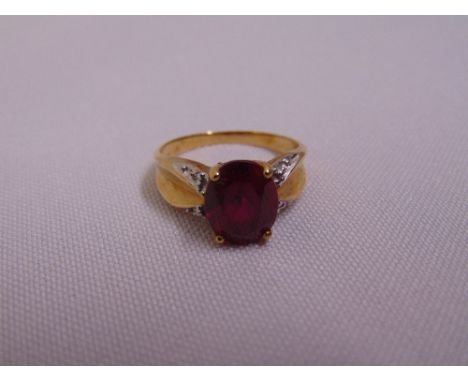 10ct yellow gold cocktail ring set with a pink stone, approx total weight 3.5g