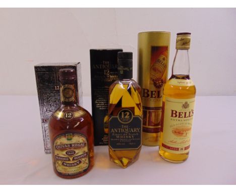 Three bottles of Scotch whisky to include Chivas Regal, J &amp; W Hardie The Antiquary 12 year old and Bells Scotch whisky
