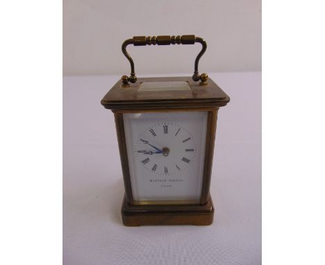 Mathew Norman brass carriage clock of customary form, white enamel dial with Roman numerals