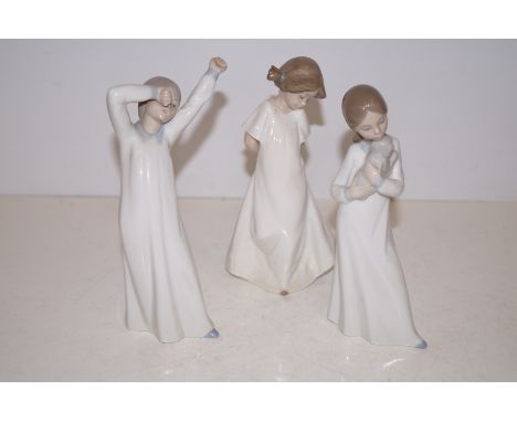 3 nao figures of young girls 