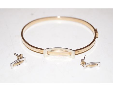 A 9 ct gold bangle with earrings 