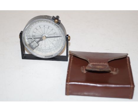 A compass in the original leather case 