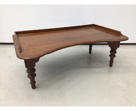Victorian mahogany reading table, of kidney form with rising rest adjusting on easel support, 69cm wide, together with magazi