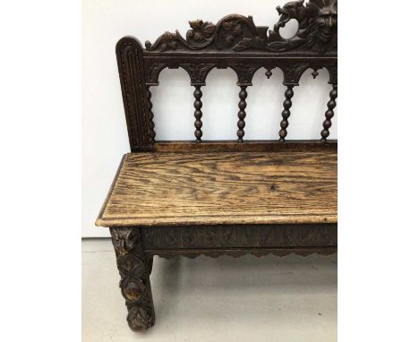 19th century carved oak bench, with bobbin turned back and solid seat, arcaded frieze on carved supports, approximately 122cm