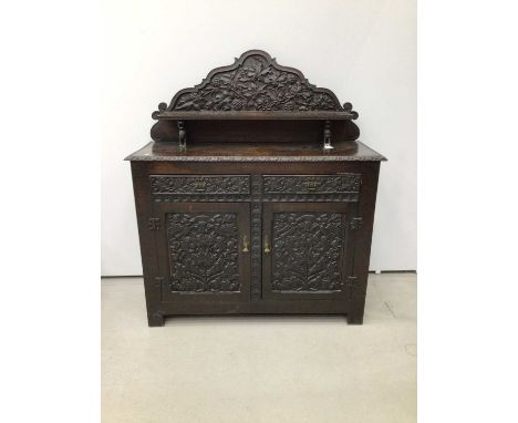 Impressive 19th century Arts and Crafts carved oak Chiffonier, with arched gallery and shelf back raised on dragon supports, 