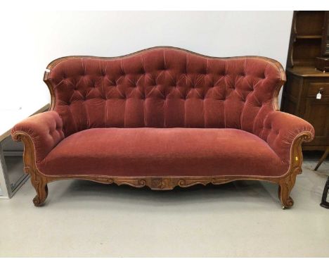 19th century Scandinavian walnut framed button upholstered sofa, with shaped showwood frame on scrolled legsCondition report: