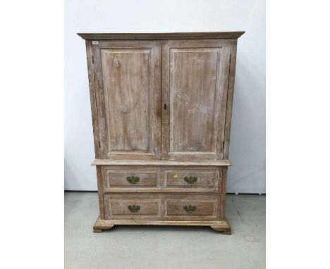 Georgian style limed oak two height cupboard, with shelved upper section enclosed by pair of feielded panelled doors, the bas