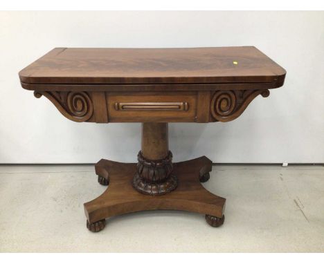 William IV mahogany card table, D-shaped fold over top enclosing circular blue baize playing surface, on lappet carved column