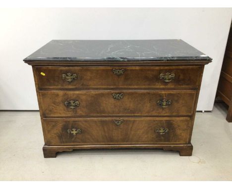 George II style walnut chest of three long drawers with associated green marble top, the drawers with brass handles and cross