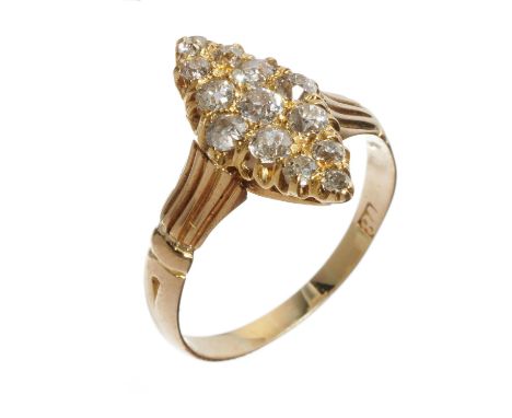 A DIAMOND MARQUISE CLUSTER RING  with old cut diamonds and fluted shoulders, in gold marked 18, 3.1g, sze O½Slight wear to ho