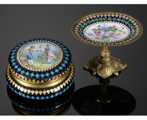 A FRENCH GILTMETAL AND ENAMEL BOX, LATE 19TH C  of round cushion shape, the lid painted with an 18th c couple, the underside 