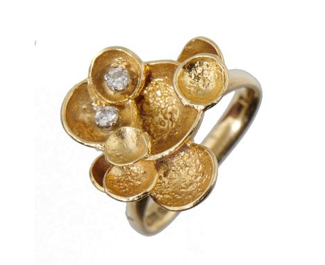 A DIAMOND AND 18CT GOLD FLOWER RING BY KUTCHINSKY  mark of Kutchinsky Ltd, London 1975, 6.5g, size G½Good condition 