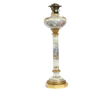 A FRENCH GILT BRASS MOUNTED PORCELAIN OIL LAMP, C1890  the scroll moulded fount, column and ogee domed foot painted by SILLIE
