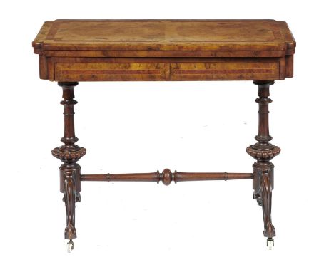 A VICTORIAN WALNUT, AMBOYNA AND LINE INLAID CARD TABLE, C1860  the quarter veneered top with re-entrant angles, pottery casto