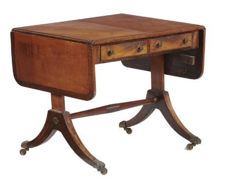 A GEORGE IV SATINWOOD, CROSSBANDED AND LINE INLAID SOFA TABLE, C1820 the top in matched veneers, the legs terminating in bras