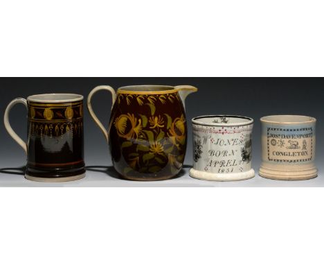 A BROWN GROUND BARREL SHAPED PEARLWARE JUG AND CYLINDRICAL MUG WITH 'NAIVE' DECORATION, C1820 both painted, the jug in green 