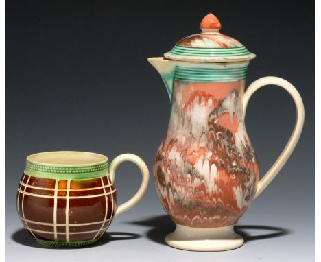 AN EARLY COMBED SLIP BALUSTER JUG AND COVER, C1790 with reeded, green glazed border, 14cm h and an engine turned globular gre
