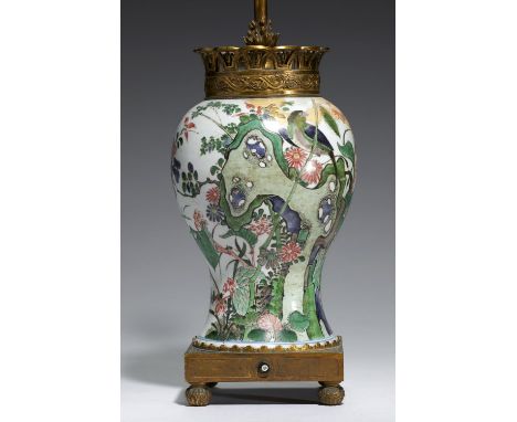 AN ORMOLU MOUNTED CHINESE FAMILLE VERTE VASE, 18TH C, MOUNTS EARLY 20TH C painted with two birds, plants and a hollow rock, 3