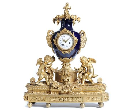 A FRENCH ORMOLU AND SEVRES STYLE GROS BLEU PORCELAIN MOUNTED MANTEL CLOCK, LATE 19TH C  the movement with outside countwheel 