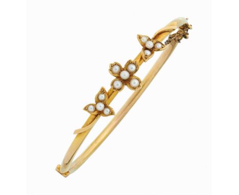 A SPLIT PEARL AND GOLD BANGLE  6.1cm, marked 15ct, 6.6cm,  morocco casePractically as new 