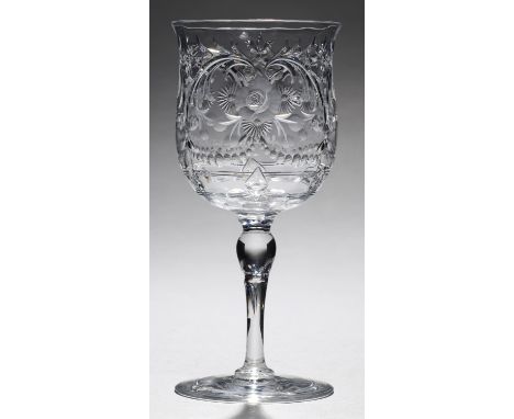 AN ENGLISH INTAGLIO ENGRAVED 'ROCK CRYSTAL' WINE GLASS, EARLY 20TH C the tulip shaped bowl engraved with flowers and C scroll