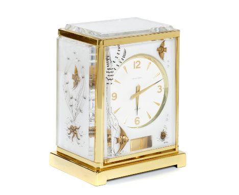A JAEGER LECOULTRE BRASS AND LUCITE ATMOS CLOCK, MARINA AND BRACKET,THIRD QUARTER 20TH C timepiece 23cm h, paper label No 272