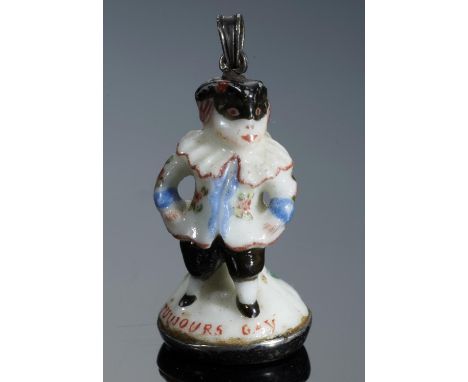 A CHELSEA PORCELAIN TOY, C1756-8  as a man in a carnival mask inscribed in red enamel TOUJOURS GAY, mounted at later date as 