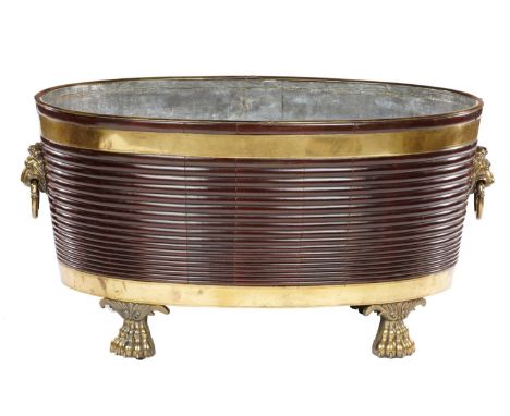 A FINE VICTORIAN BRASS BOUND MAHOGANY WINE COOLER OF UNUSUAL SIZE, 19TH C  with ribbed sides and  of flared oval shape, the r