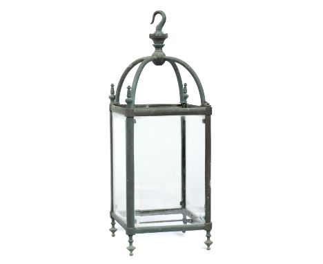 A BRASS HALL LANTERN, C1900 with bevelled glass lights, 57cm h including hookOxidised/verdigris.  Lacking one of the four fin