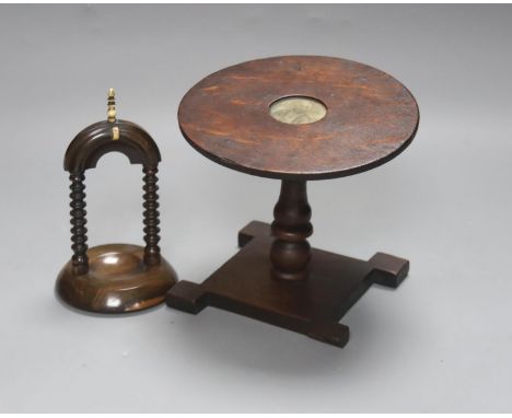 A 19th century oak miniature tilt top table with naval portrait, 23.5cm high tilted up, and a lignum vitae watchstand