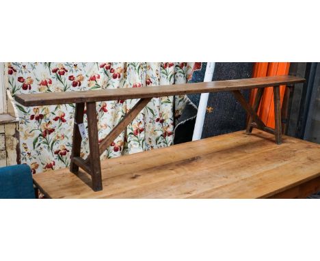 A 19th century French provincial oak bench seat, length 194cm, depth 30cm, height 42cm