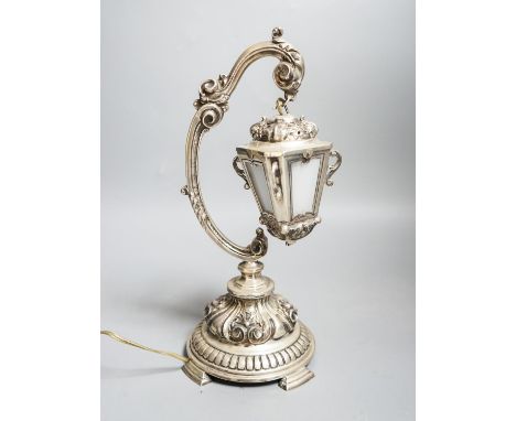 A Portuguese white metal table lamp modelled as a hanging lantern, height 28.1cm.