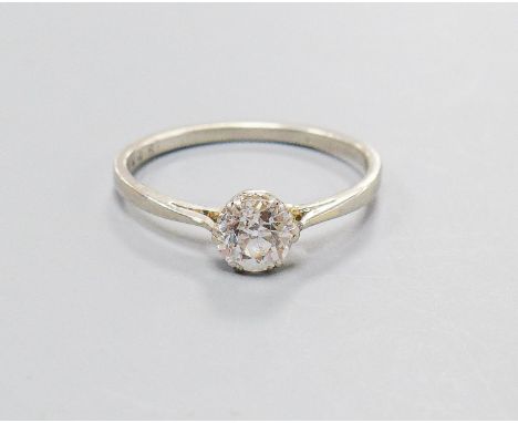 A white metal and solitaire diamond set ring, size K/L, gross weight 2.4 grams,the stone weighing approximately 0.65ct.