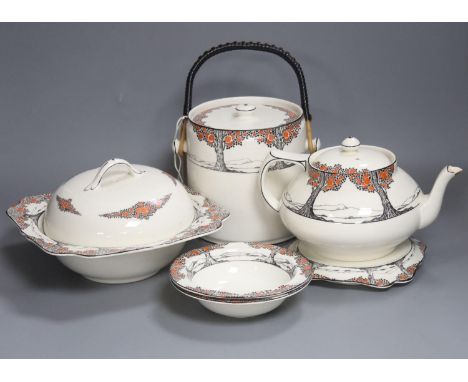 A Crown Ducal Art Deco 'Orange Tree' breakfast, tea and coffee service, to include a biscuit barrel, cheese dish and toast ra