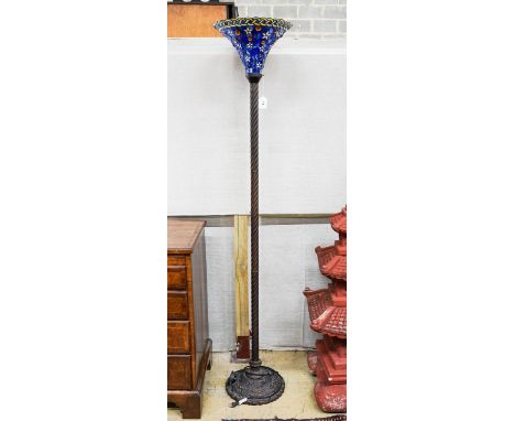 A bronzed finish Tiffany style uplighter floor lamp with flared blue leaded shade, 187cm high, 36cm diameter