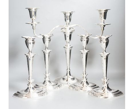 A set of four George V silver oval candlesticks, Atkin Brothers, Sheffield, 1911, height 24.2cm, together with a later silver