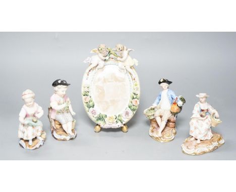 A pair of Meissen groups holding chickens, 10.5cm, a pair of Sitzendorph figures and a Sitzendorf mirror 18cm