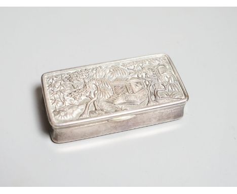 A late 19th/early 20th century Chinese silver rectangular snuff box by Wang Hing,decorated with huts amongst bamboo, 71mm.