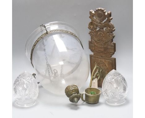 A Dutch carved wood and brass wall candle holder and a hanging glass lantern with cover
