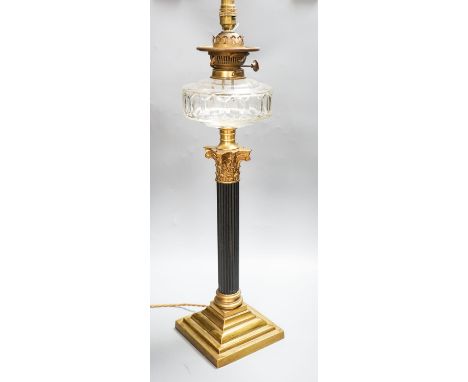 An early 20th century corinthian column oil lamp, converted for electricity, total height 67 cm