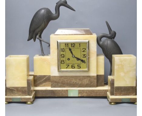 An Art Deco marble clock garniture clock surmounted with two spelter cranes,42cm