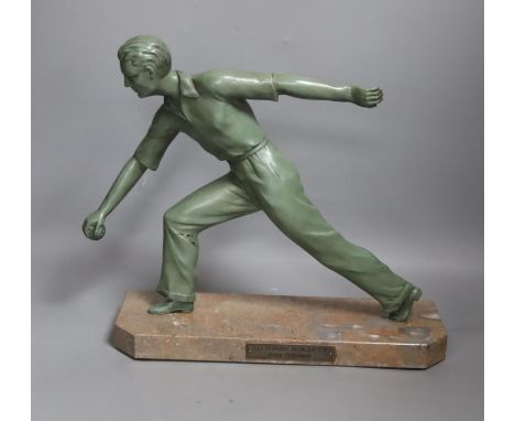An Art Deco model of a gentleman playing boules. Marble base with plaque reading ‘Les boulistes de l-A.S.P.T.T a leur Preside