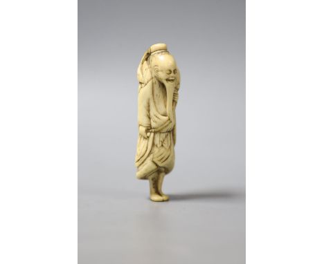 A late 18th/early 19th century Japanese carved stag antler netsuke modelled as a Sennin, 7.4 cm