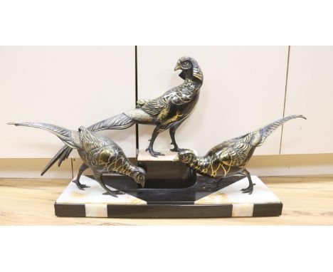 An Art Deco cold painted and gilded spelter model of 3 pheasants on a black and rouge marble base, 89cm