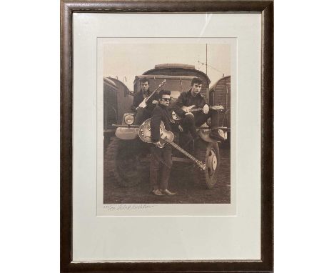 A well mounted and framed print of an image taken in Hamburg by Astrid Kirchherr depicting John Lennon, George Harrison and S