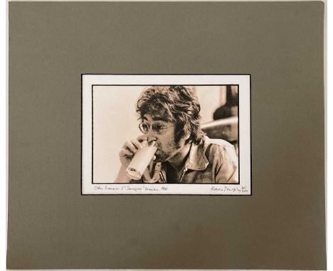 A mounted, limited edition photo print of an image by Kieron 'Spud' Murphy depicting John Lennon during a break in recording 