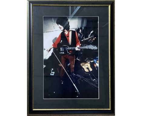 An original colour photograph depicting George Harrison during the Let It Be sessions, mounted and framed (frame 41 x 53cm), 