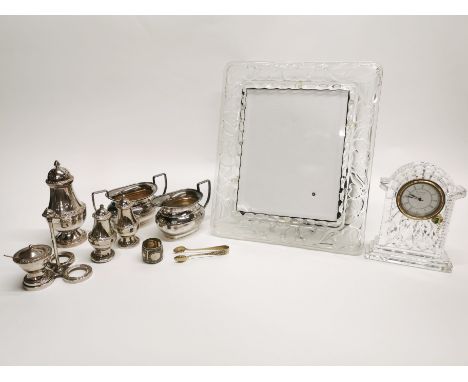 A Waterford crystal mantle clock with a crystal photo frame and other items.