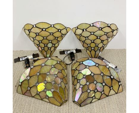 A set of four Tiffany style wall light shades, W. 30cm.