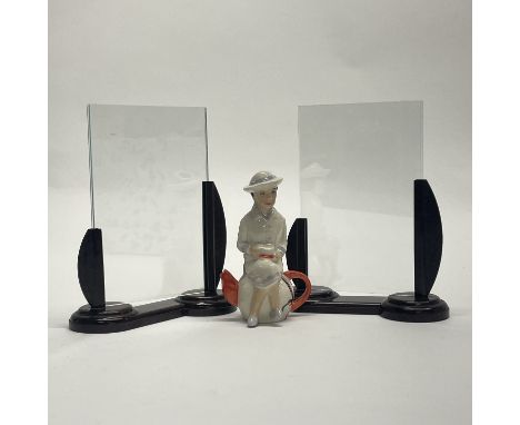 Two Art Deco bakelite photograph frames, H. 14cm, together with a porcelain Kevin Francis figure of Susie Cooper.